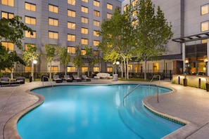 Outdoor pool, open 9:00 AM to 10:00 PM, pool loungers