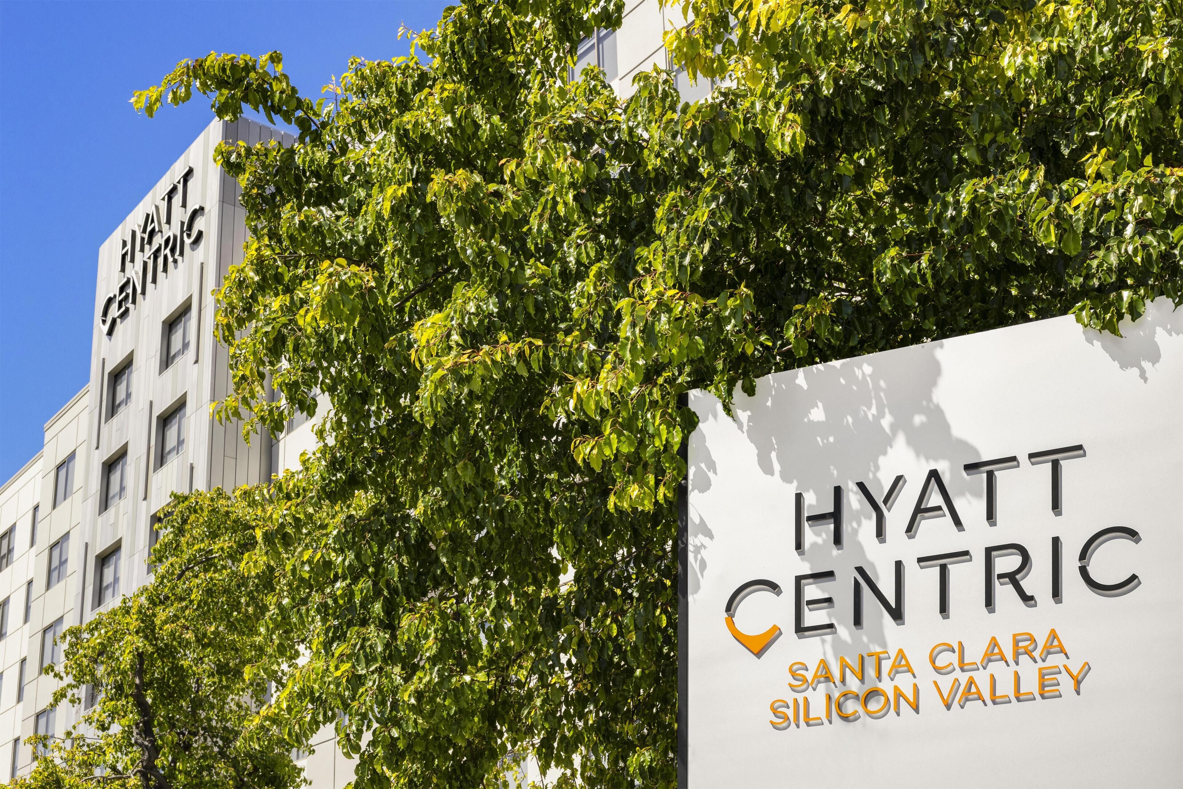 A building with a sign that reads 'HYATT CENTRIC SANTA CLARA SILICON VALLEY'.