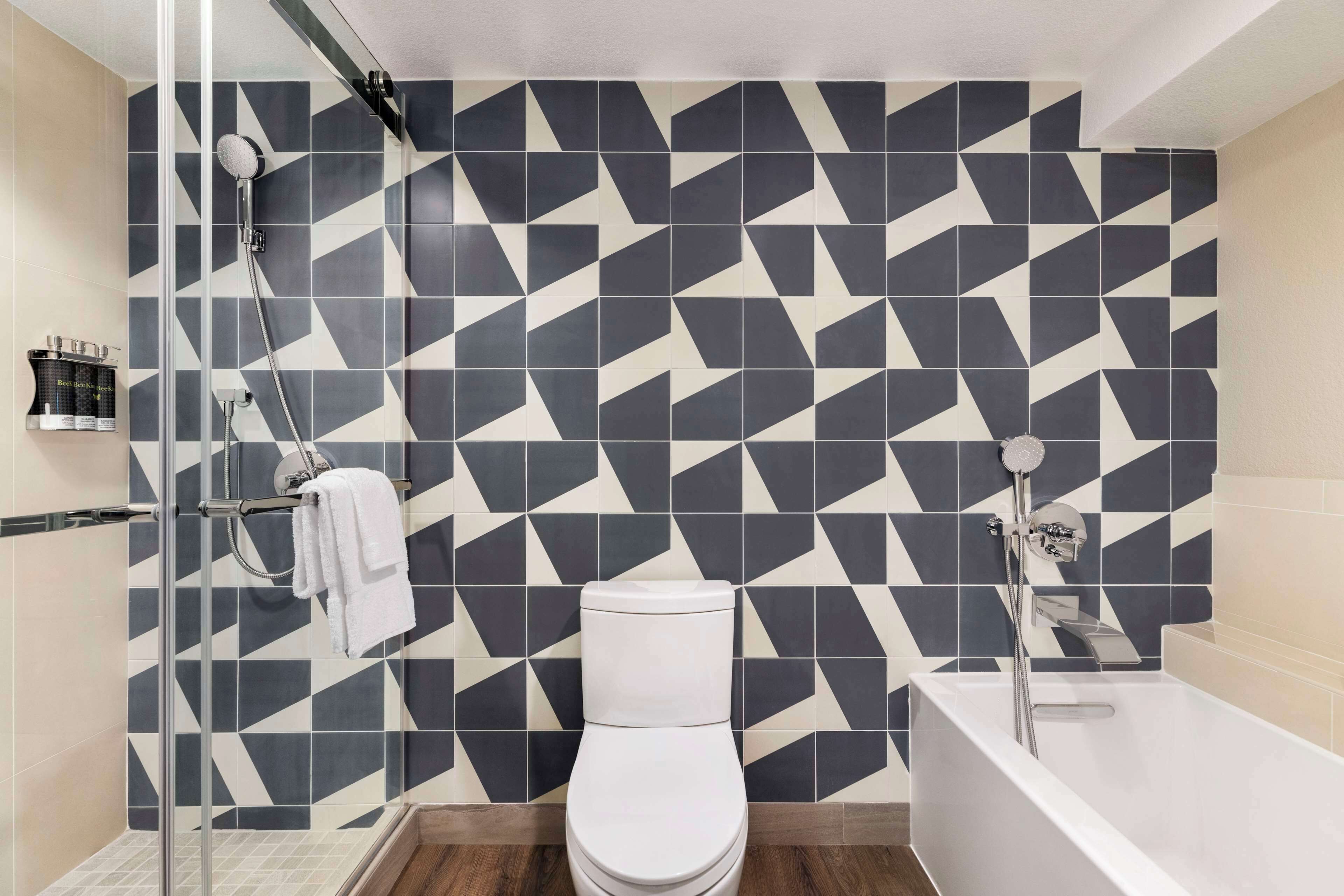 premium suite (king) | bathroom | shower, rainfall showerhead, designer toiletries, hair dryer