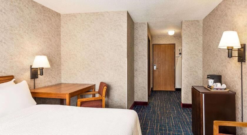 Premium bedding, desk, laptop workspace, iron/ironing board