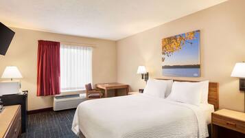 Premium bedding, desk, laptop workspace, iron/ironing board