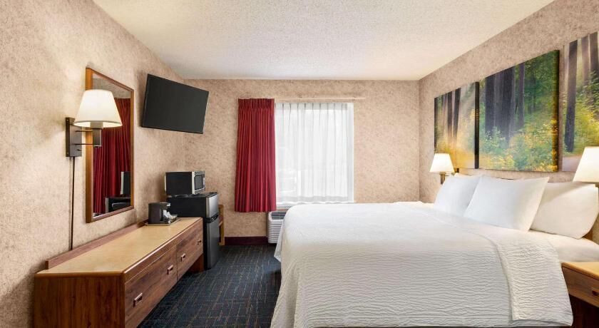 Premium bedding, desk, laptop workspace, iron/ironing board