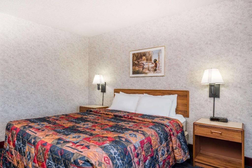 Premium bedding, desk, laptop workspace, iron/ironing board