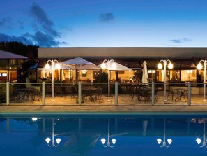 Seasonal outdoor pool, open 10:00 AM to 8 PM, pool umbrellas