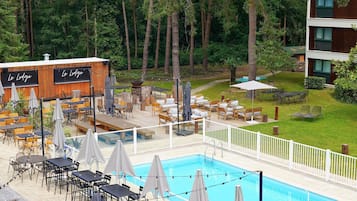 Seasonal outdoor pool, open 10:00 AM to 8 PM, pool umbrellas