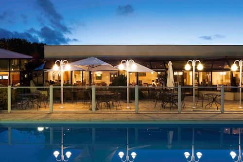Seasonal outdoor pool, open 10:00 AM to 8 PM, pool umbrellas