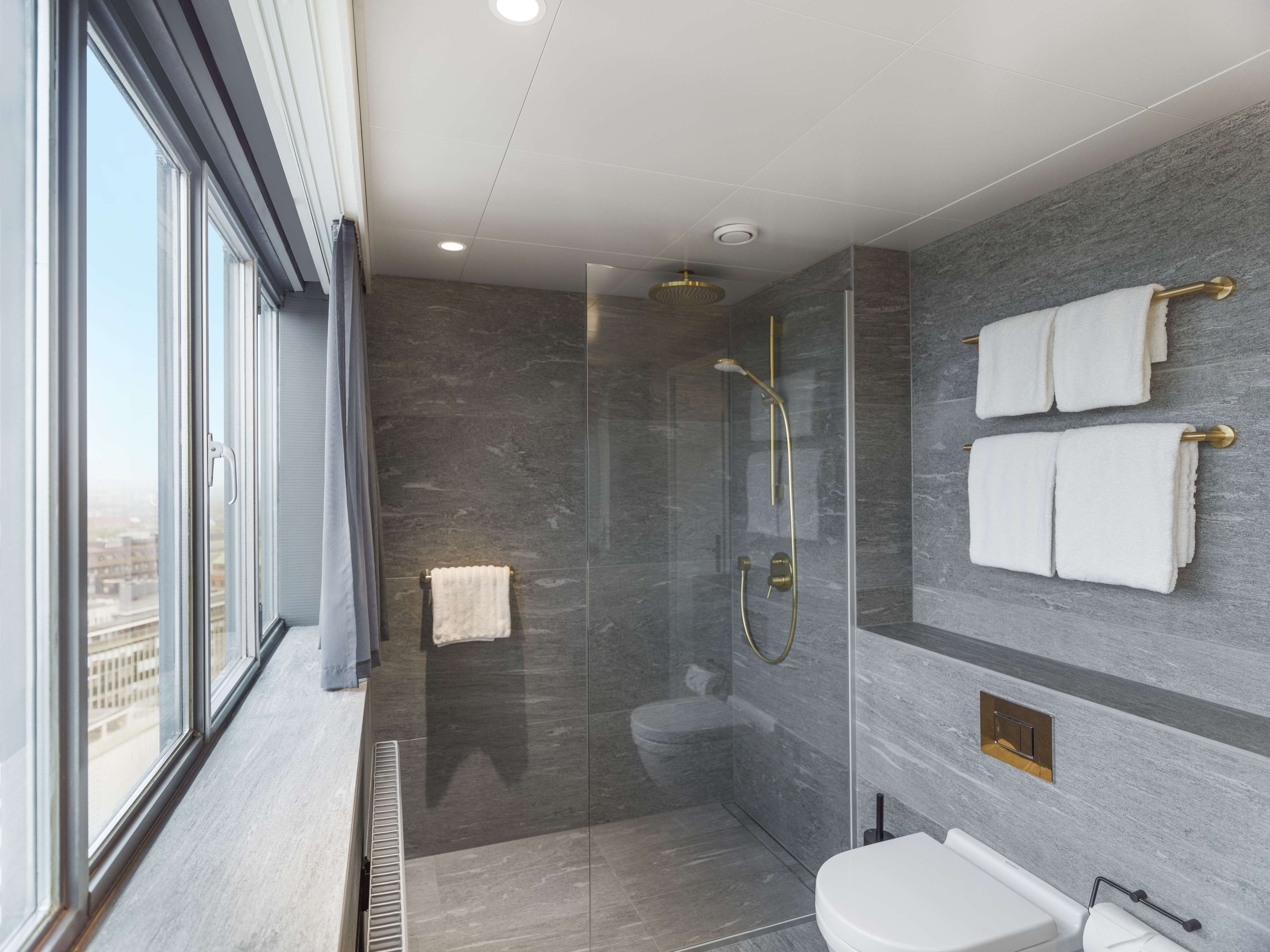 junior suite | bathroom | hair dryer, bathrobes, slippers, towels