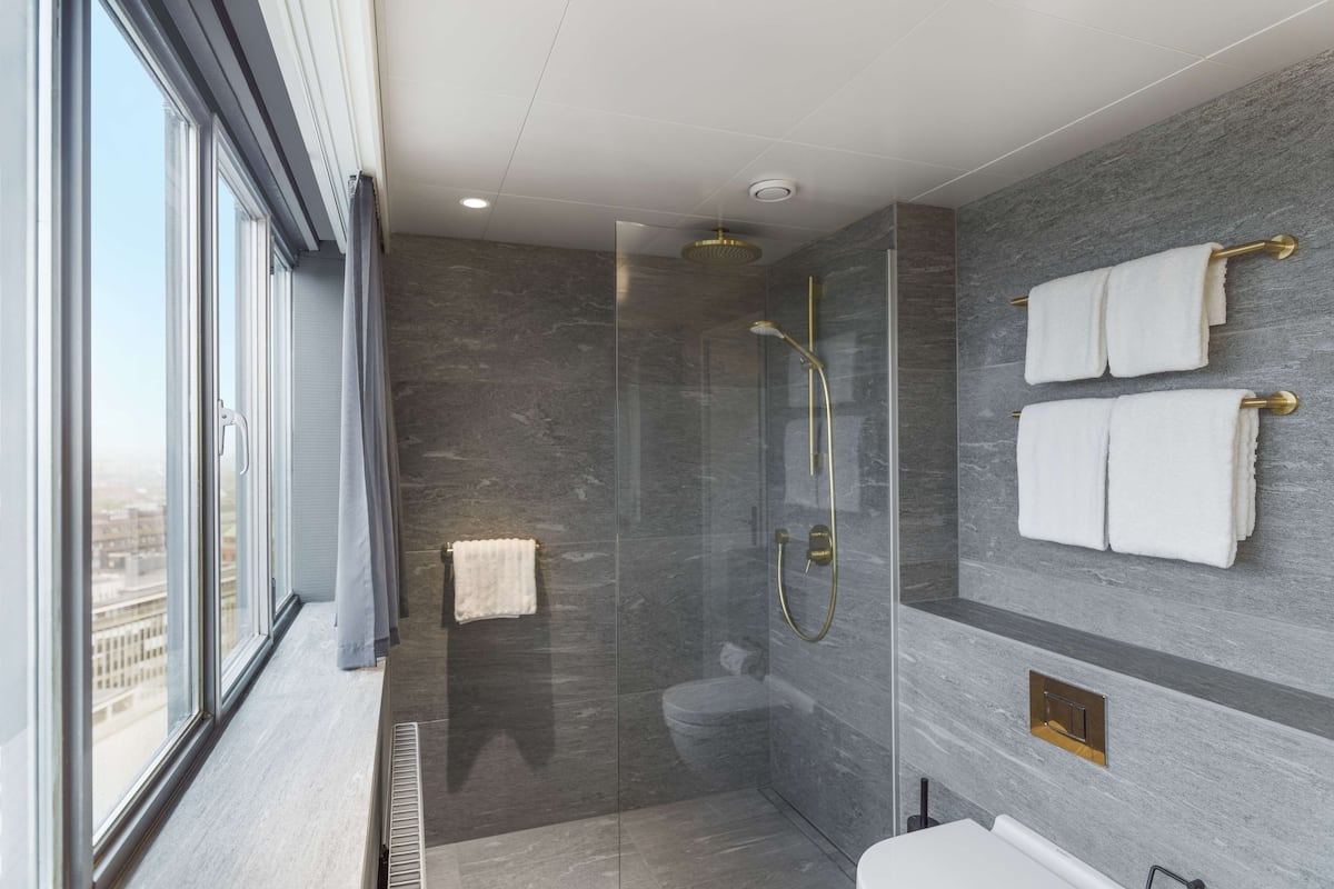 junior suite | bathroom | hair dryer, bathrobes, slippers, towels