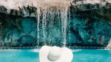 Outdoor pool, open 7:00 AM to 11 PM, pool umbrellas, sun loungers