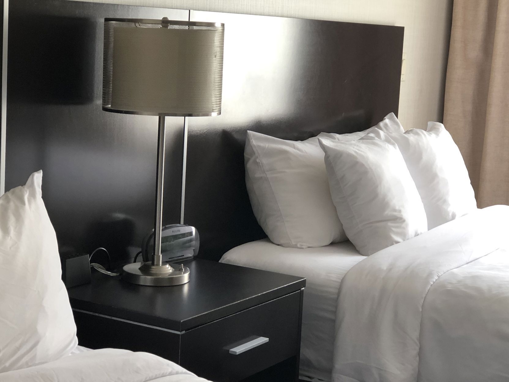 Desk, laptop workspace, iron/ironing board, bed sheets