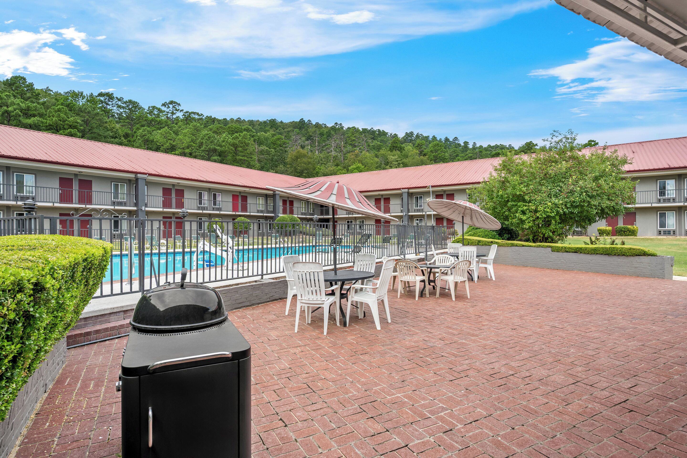 Seasonal outdoor pool, open 9:00 AM to 9:00 PM, pool umbrellas