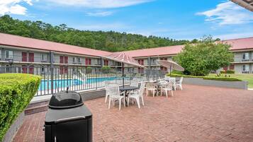 Seasonal outdoor pool, open 9:00 AM to 9:00 PM, pool umbrellas