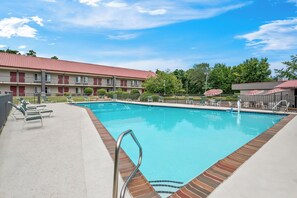 Seasonal outdoor pool, open 9:00 AM to 9:00 PM, pool umbrellas