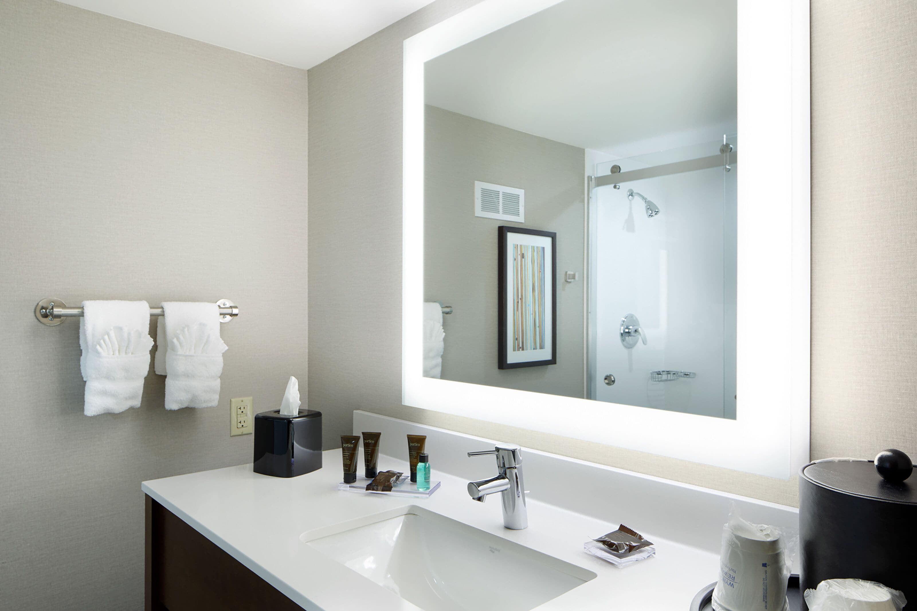 combined shower/bathtub, designer toiletries, hair dryer, towels