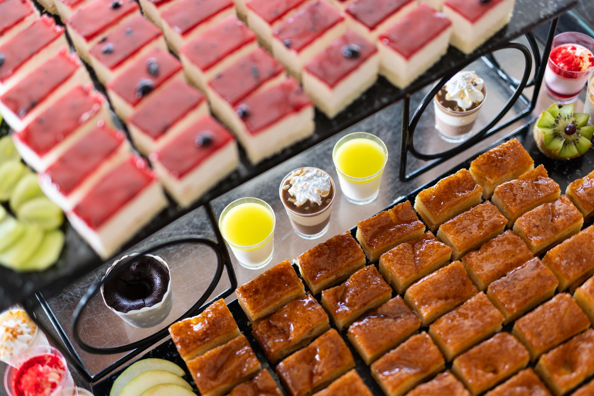 A variety of desserts and beverages arranged on a tray.