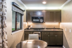 Suite, 1 King Bed | Private kitchen | Mini-fridge, microwave, coffee/tea maker
