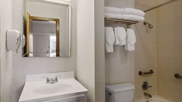 A bathroom with a sink, toilet, and shower.