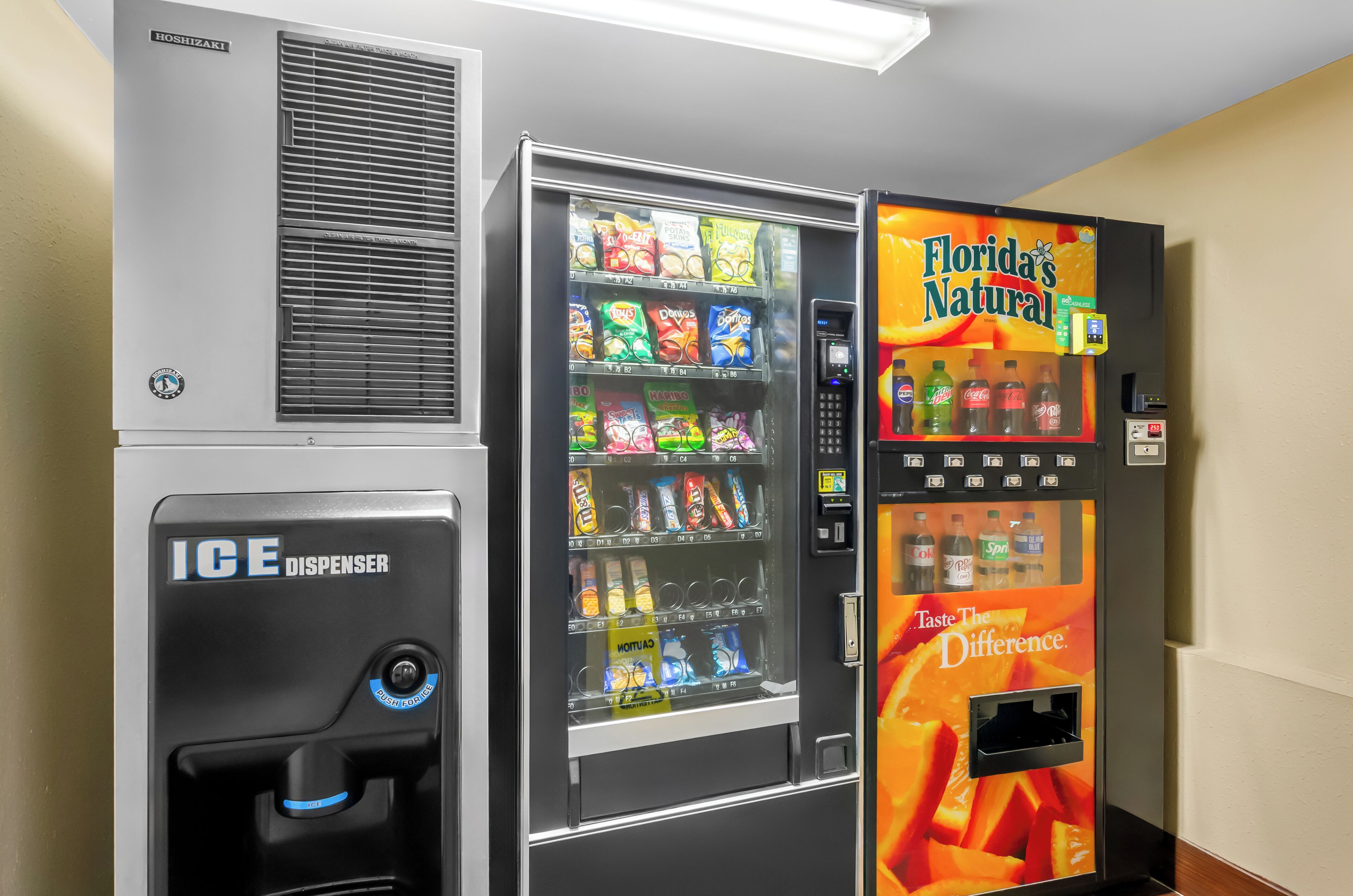 A vending machine with snacks and a Florida's Natural drink dispenser.