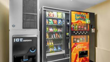 A vending machine with snacks and a Florida's Natural drink dispenser.