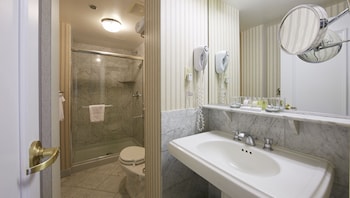 Hotel amenities such as safe, desk and work area at Warwick Allerton - Chicago