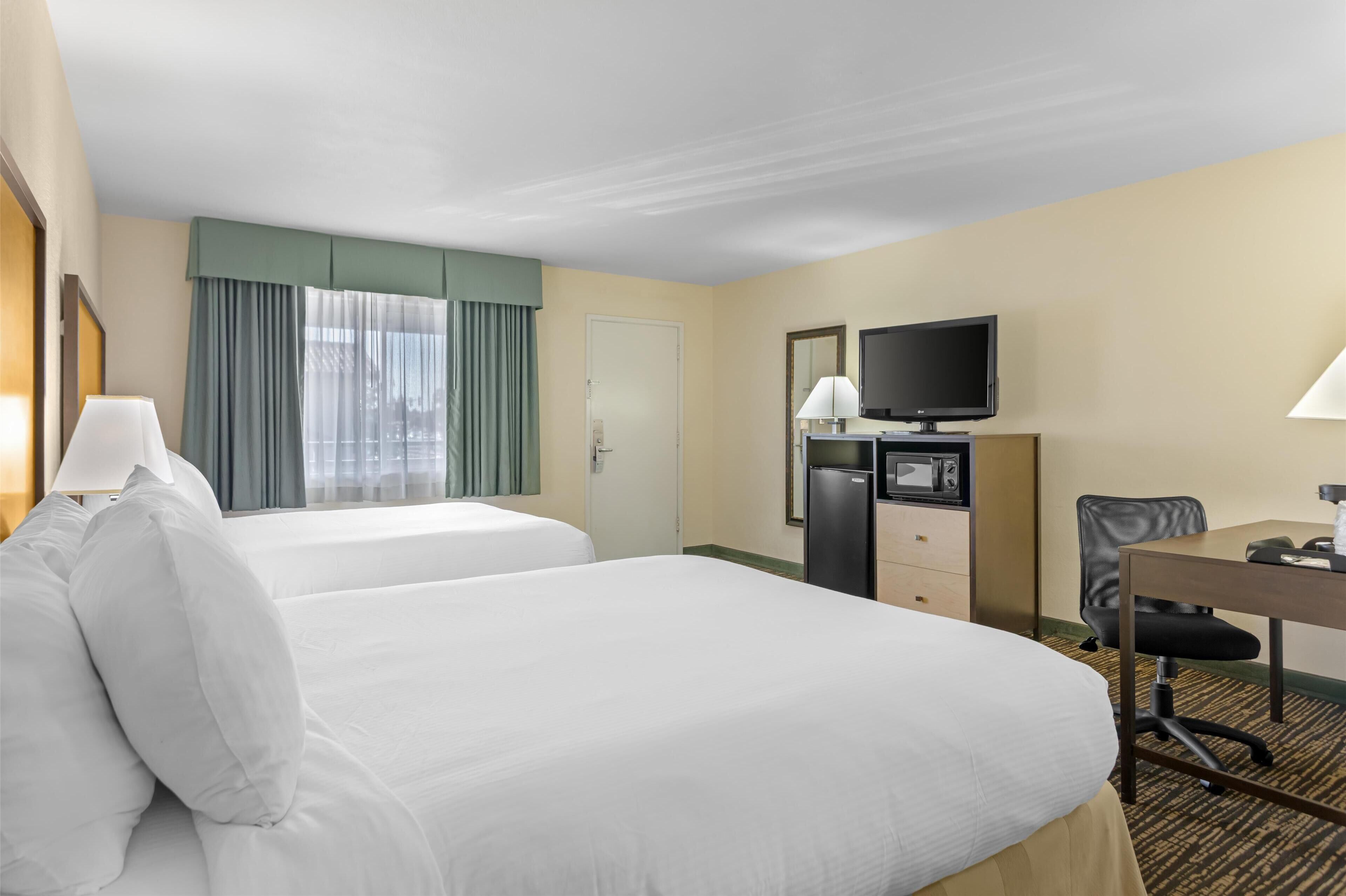 standard room, 2 queen beds, non smoking, refrigerator & microwave (pet friendly) | desk, laptop workspace, iron/ironing board, wifi