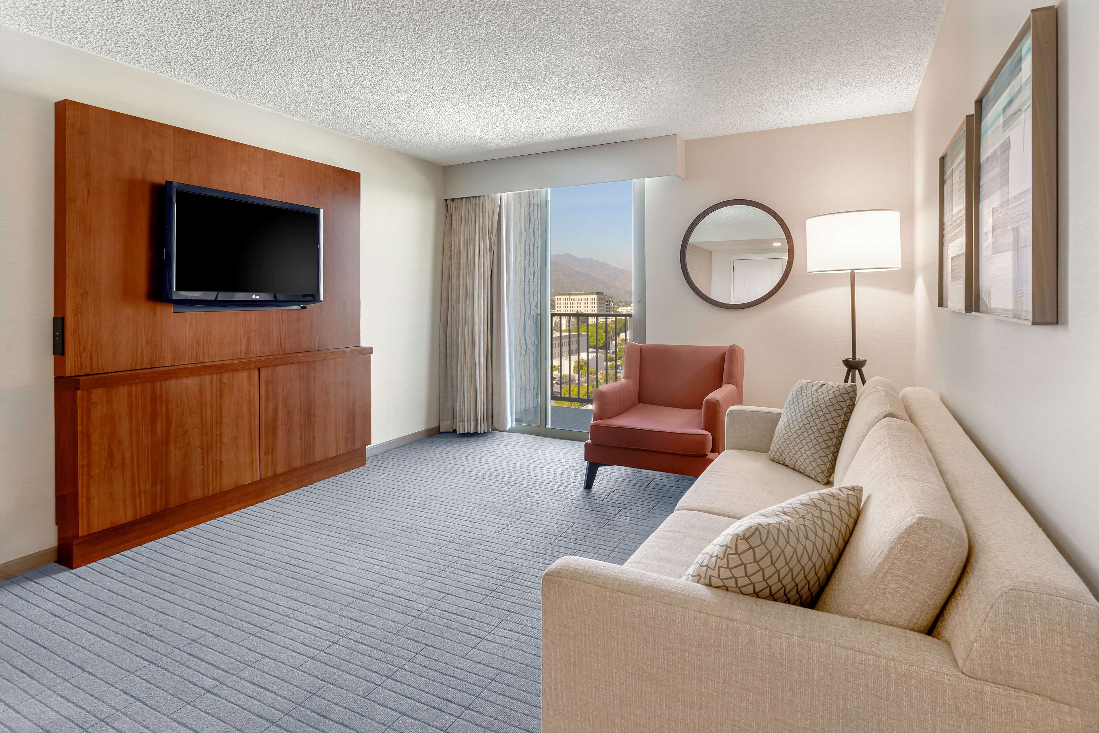 suite, 1 king bed | living area | 55-inch flat-screen tv with cable channels, tv, pay films