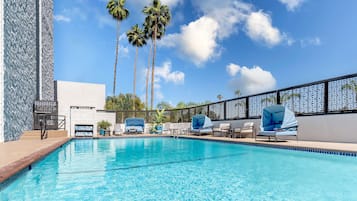Outdoor pool, pool umbrellas, sun loungers