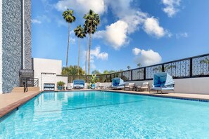 Outdoor pool, pool umbrellas, sun loungers