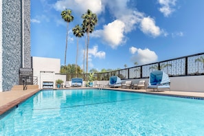 Outdoor pool, pool umbrellas, sun loungers