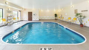 An indoor swimming pool with clear water, yellow chairs, and a sign indicating a depth of 3 feet 6 inches. - Fairfield Inn & Suites by Marriott Springfield (Springfield)