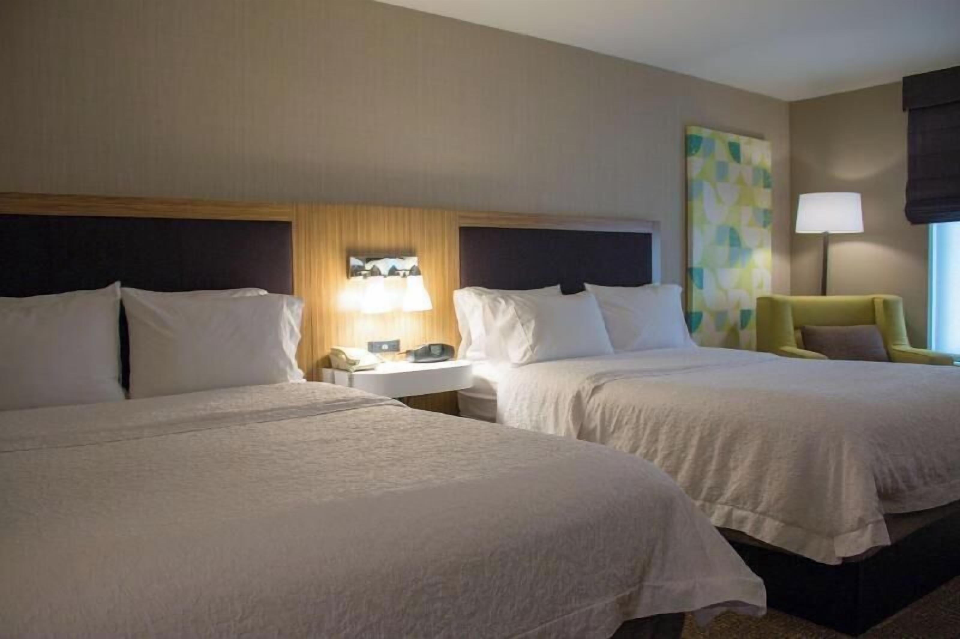 Premium bedding, desk, laptop workspace, blackout curtains