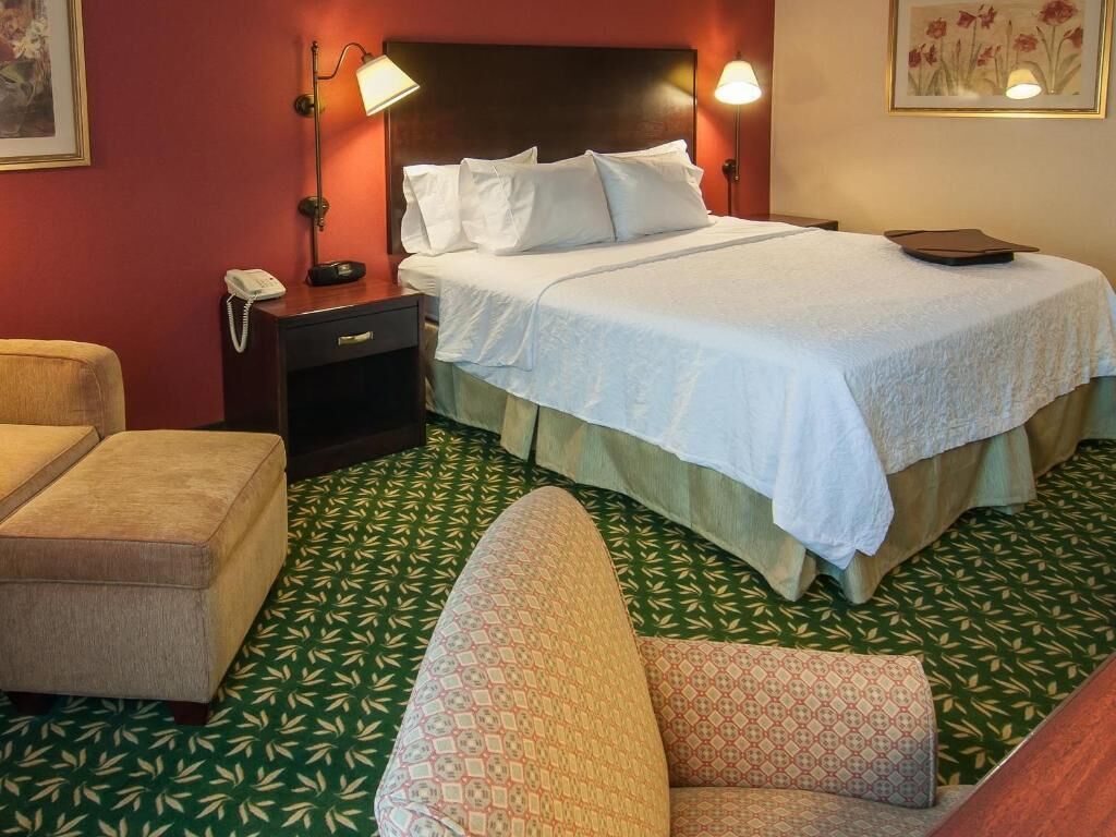 Premium bedding, desk, laptop workspace, blackout curtains