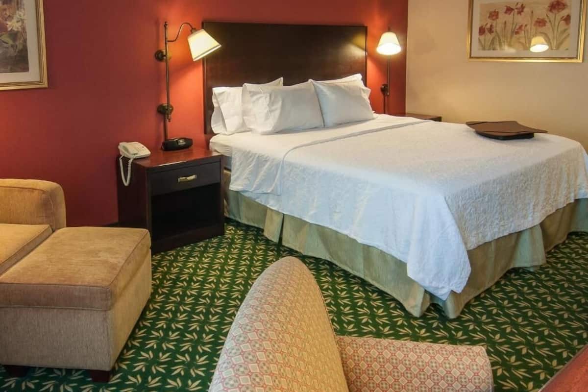 Premium bedding, desk, laptop workspace, blackout curtains