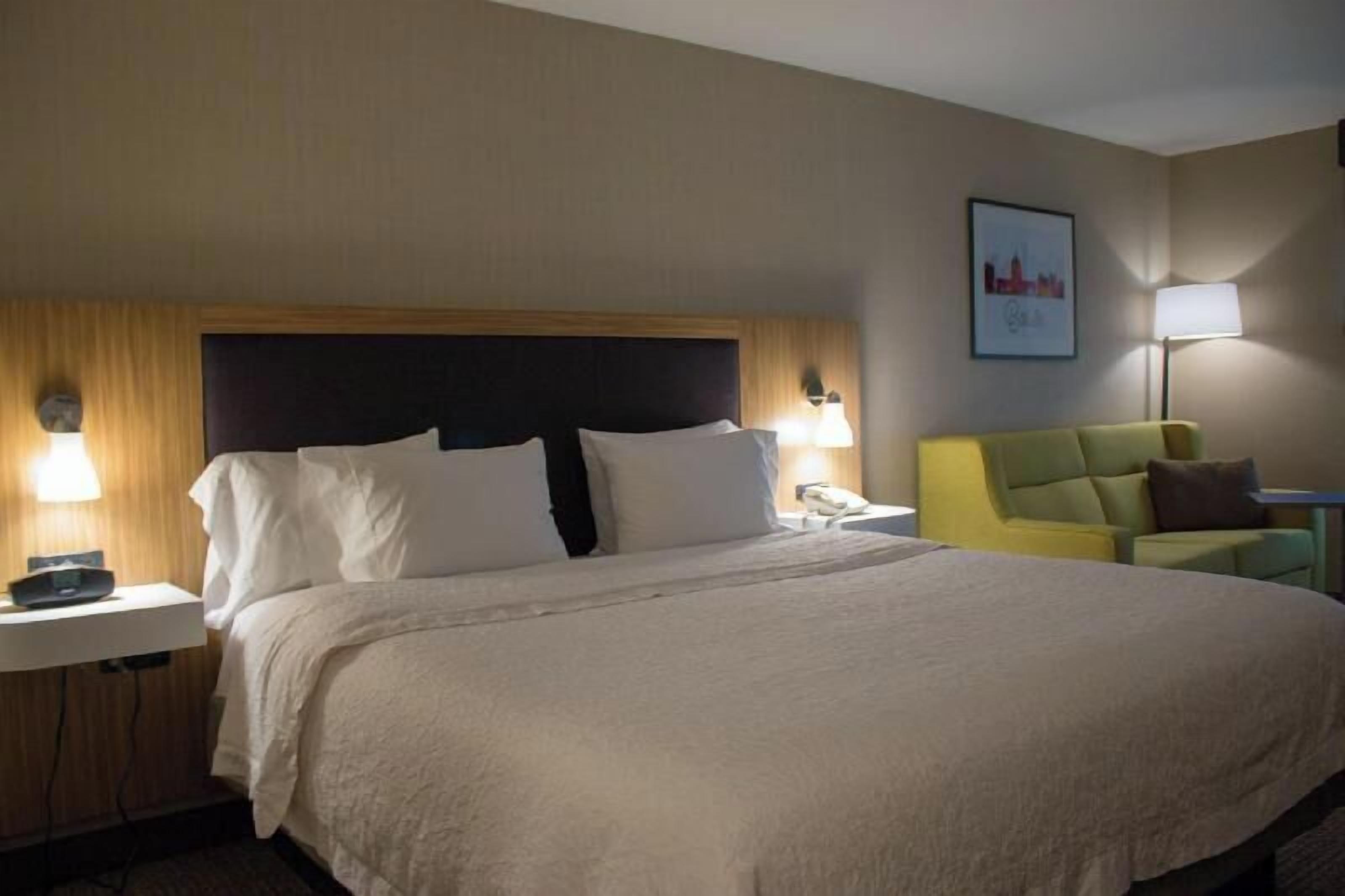 Premium bedding, desk, laptop workspace, blackout curtains