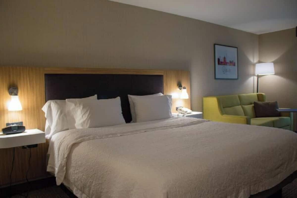 Premium bedding, desk, laptop workspace, blackout curtains