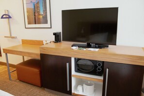 Premium bedding, desk, laptop workspace, blackout drapes