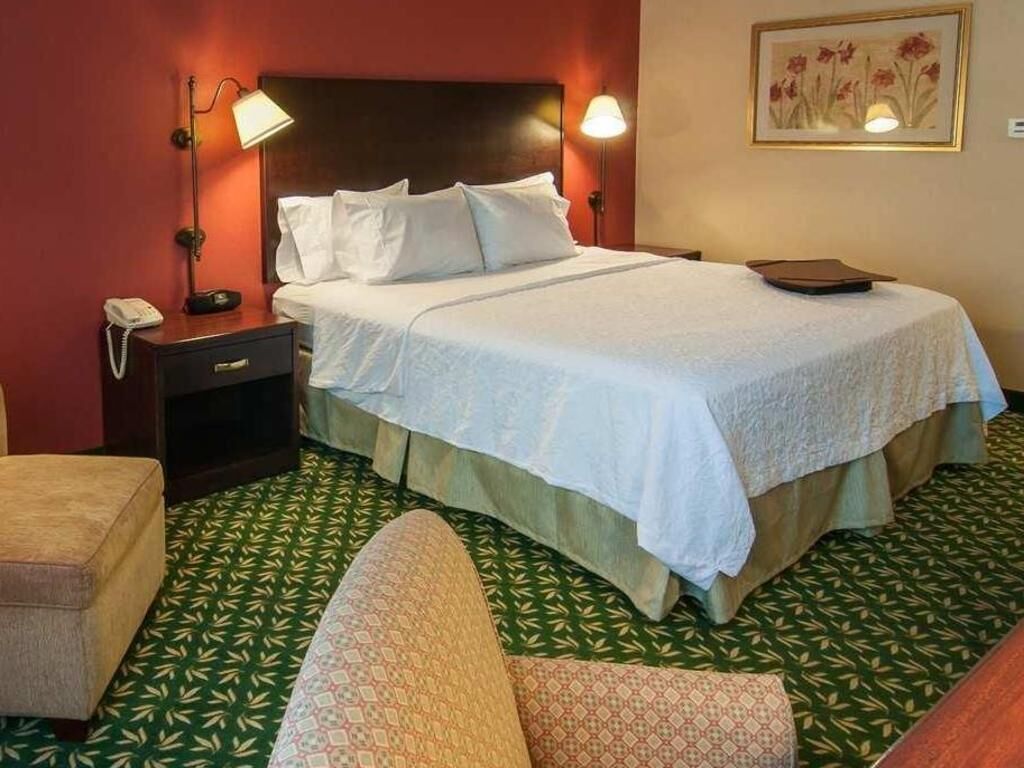 Premium bedding, desk, laptop workspace, blackout curtains