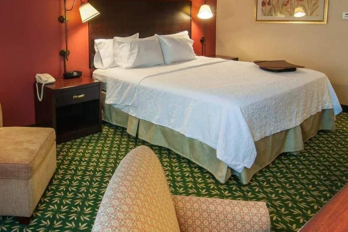 Premium bedding, desk, laptop workspace, blackout curtains