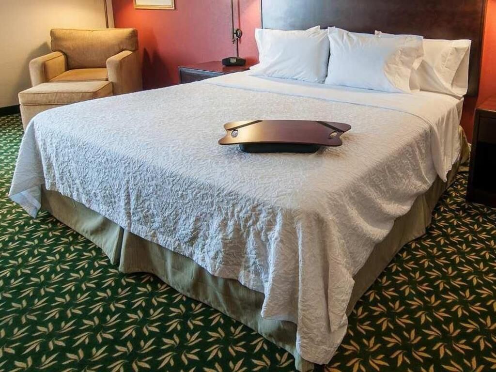 Premium bedding, desk, laptop workspace, blackout curtains
