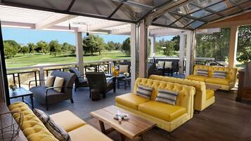 Breakfast, lunch, dinner served; golf course views