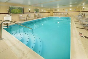 A swimming pool with a 3ft depth marker, poolside chairs, and a lifeguard on duty sign. - Holiday Inn Express Waldorf by IHG (Waldorf)