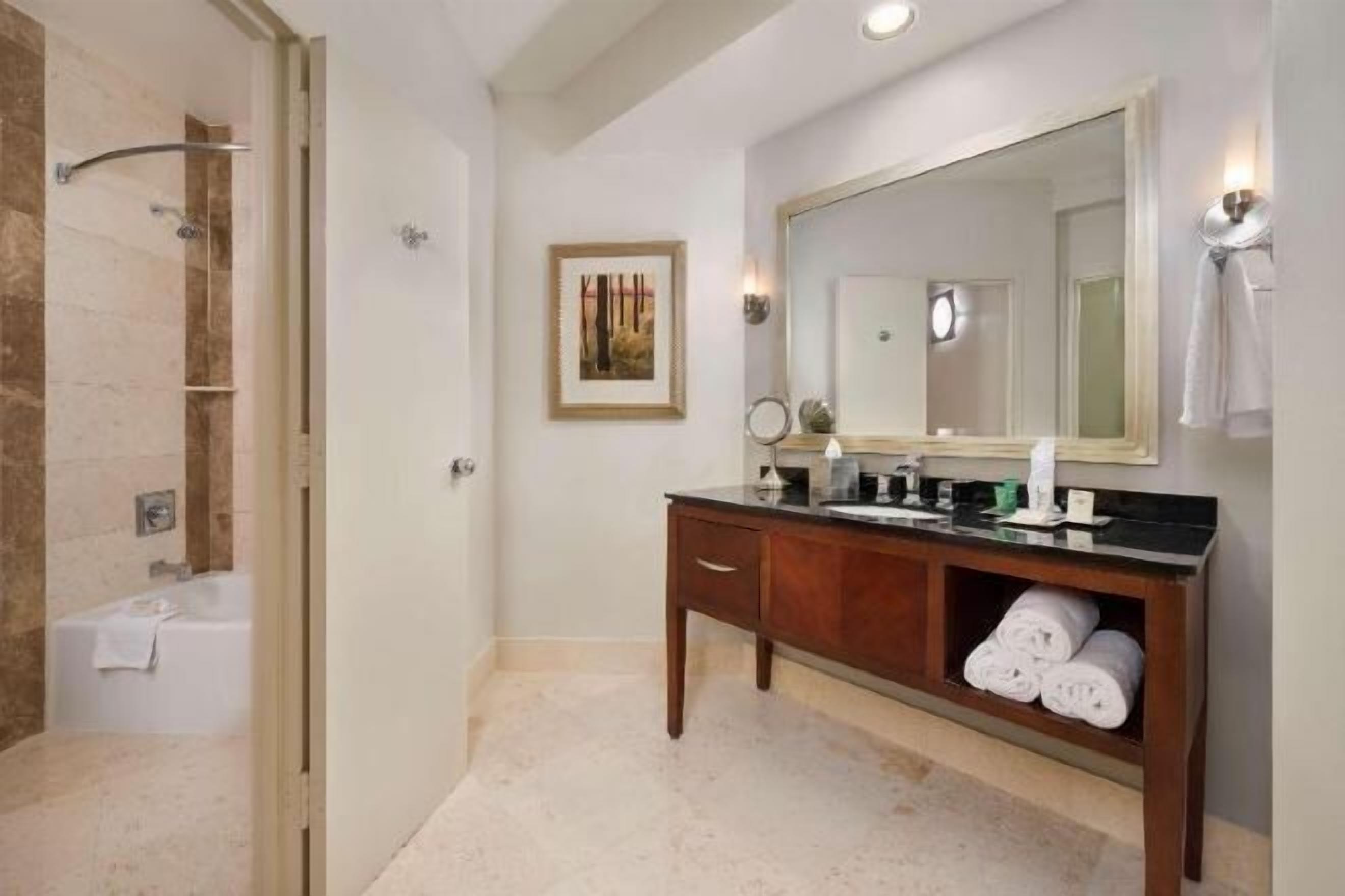Combined shower/bathtub, designer toiletries, hair dryer, towels
