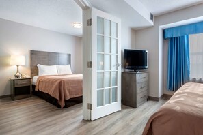 Suite, 1 King Bed and 1 Queen Bed, Non Smoking | Premium bedding, desk, laptop workspace, iron/ironing board