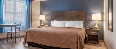 Premium bedding, desk, laptop workspace, iron/ironing board