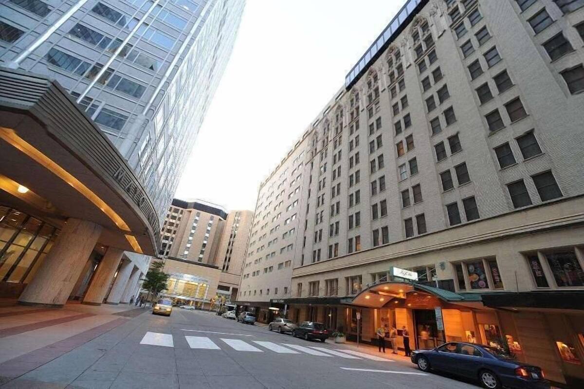 A hotel with a modern facade, large windows, and a prominent entrance.