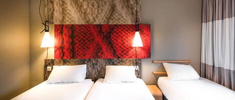 A hotel room with two beds, a large abstract wall art piece, and a curtain on the right side.