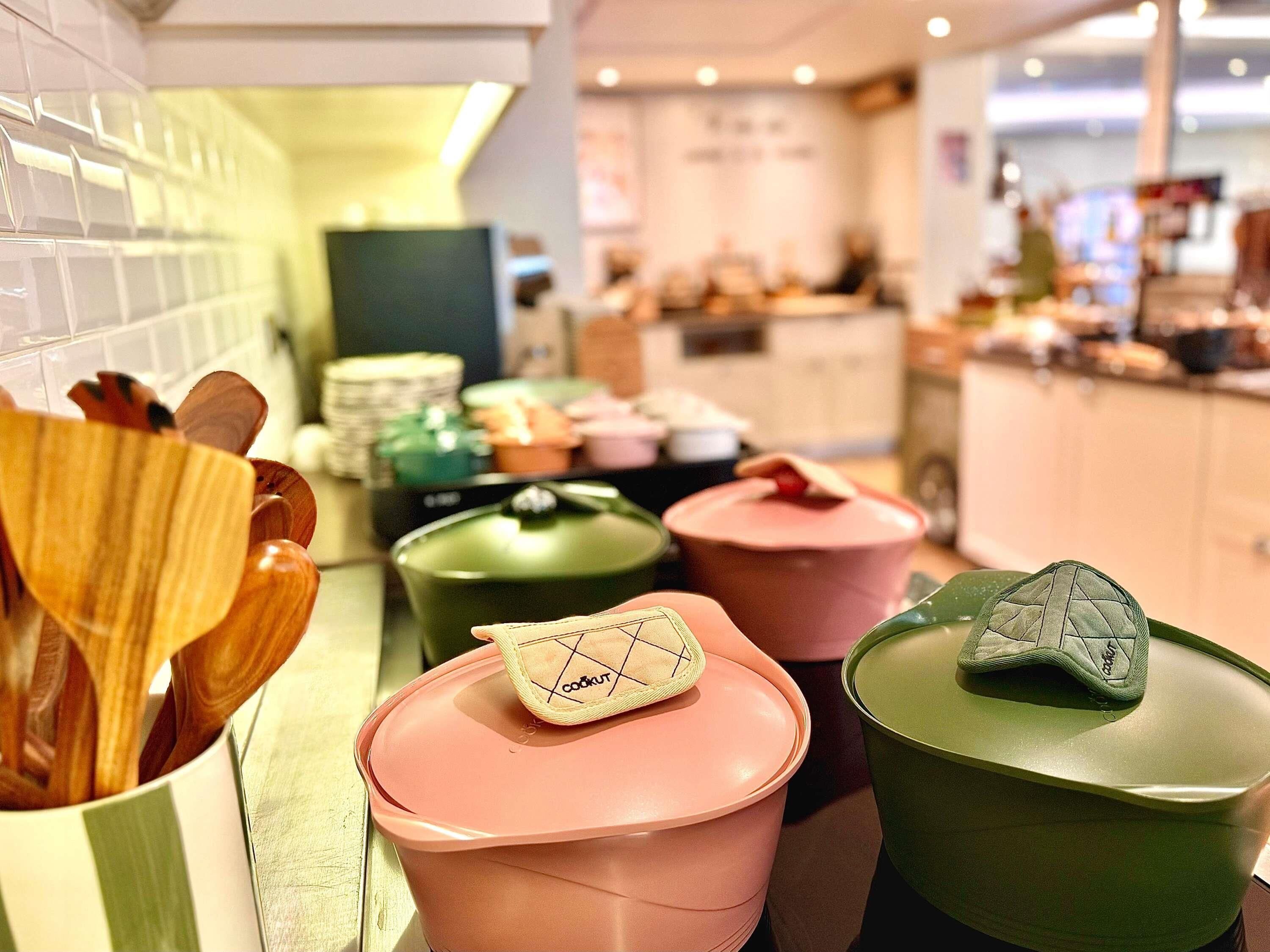 A kitchen area with various containers and utensils.