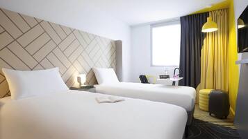 Standard Room, 2 Twin Beds | In-room safe, individually decorated, desk, blackout drapes