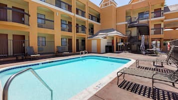 Outdoor pool, open 9:00 AM to 7:00 PM, pool umbrellas, pool loungers