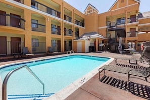 Outdoor pool, open 9:00 AM to 7:00 PM, pool umbrellas, pool loungers